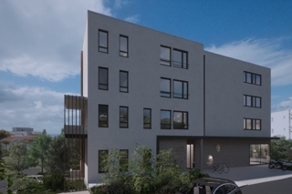 Moderno appartamento con tre camere da letto e balcone in un edificio di nuova costruzione