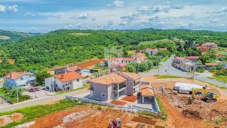 Momiano, dintorni! Casa bifamiliare con piscina in un nuovo edificio!