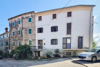 Stone house in a row with a sea view