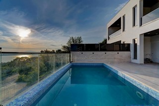 Modern house with a pool and a panoramic view of the sea