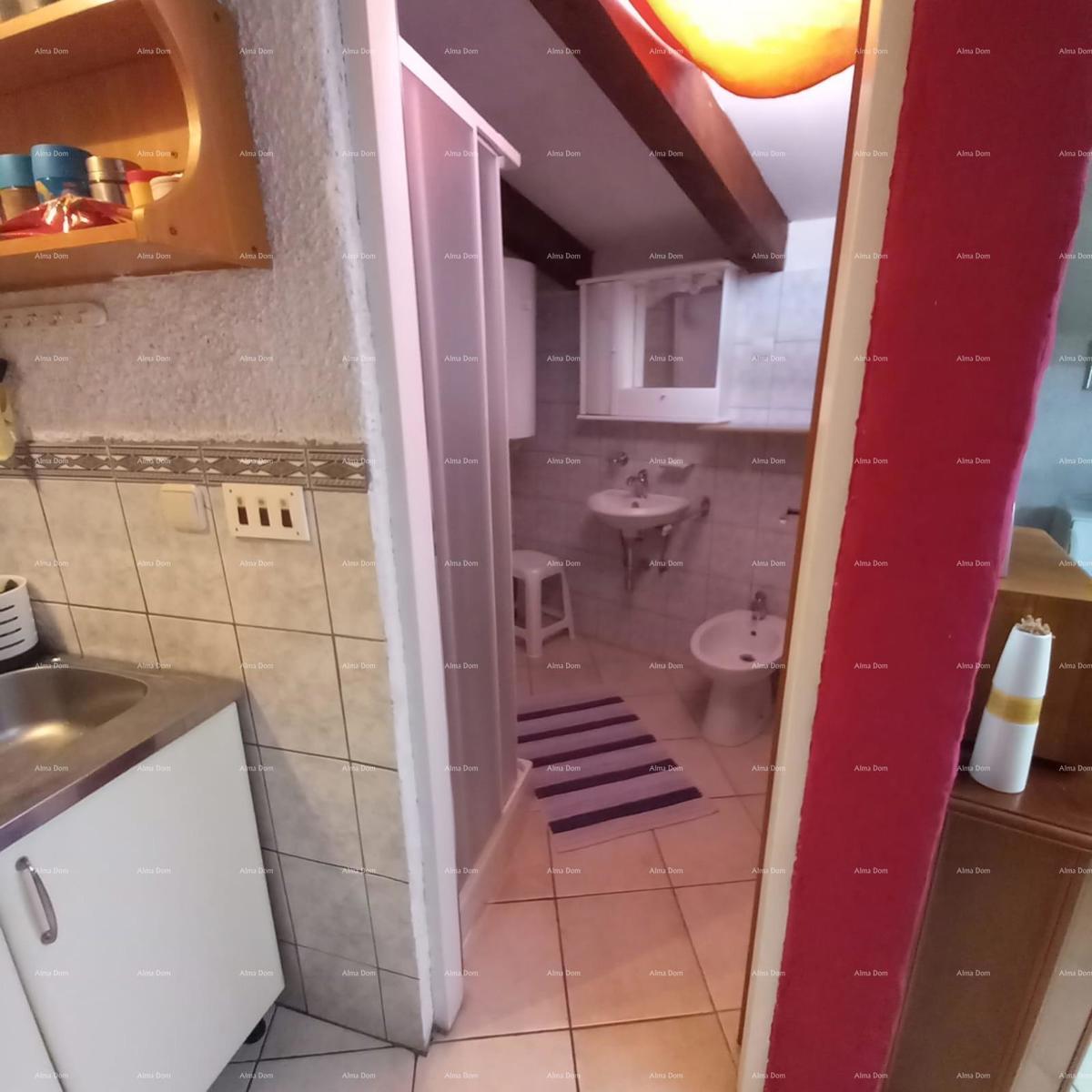 Casa spaziosa a Marčana con tre piani e giardino in vendita.