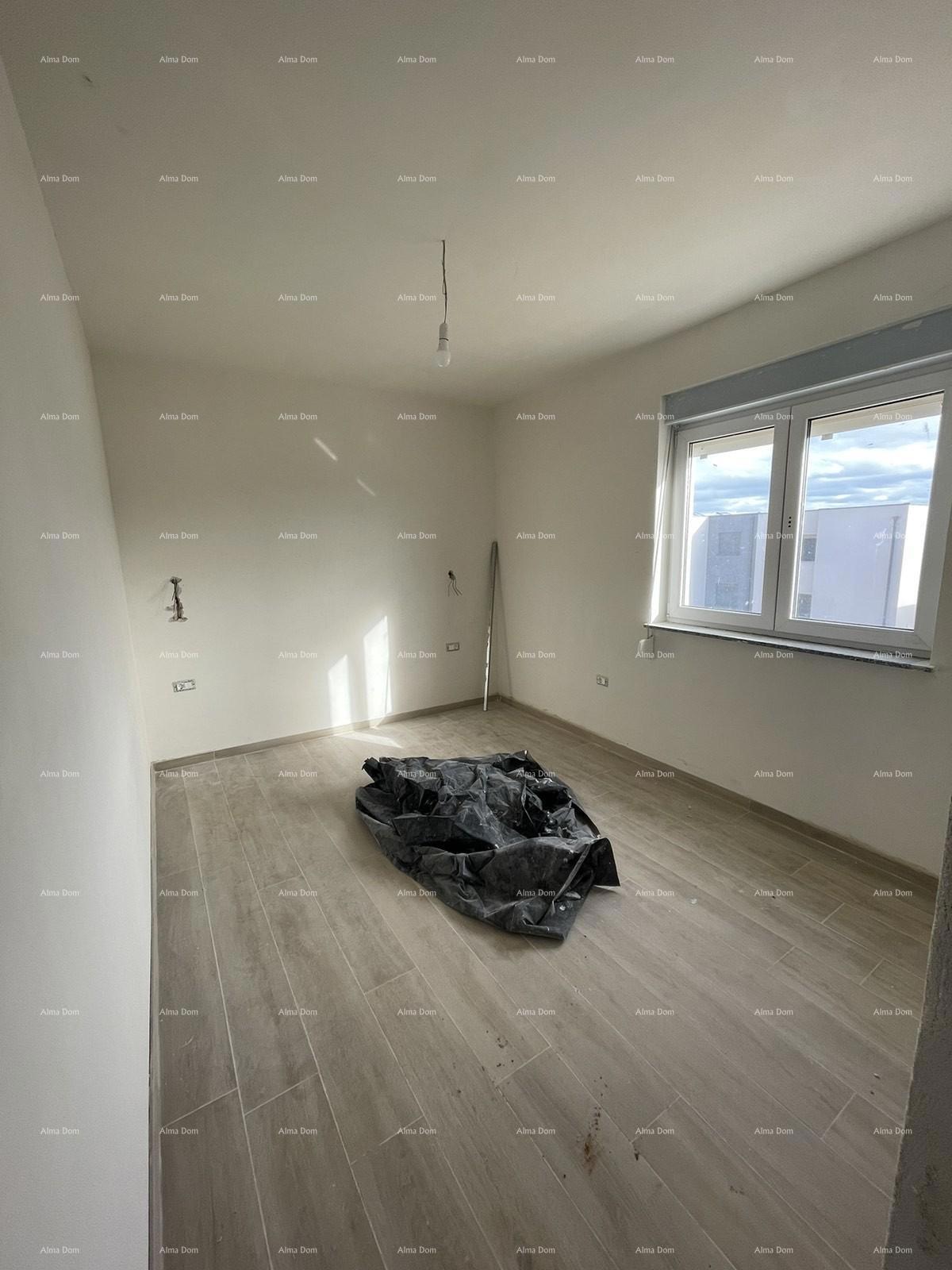 In vendita casa con tre appartamenti a Medolino