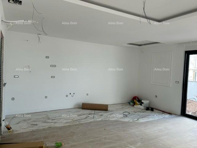 ŠTINJAN.  In vendita: Appartamento in un edificio nuovo con giardino!