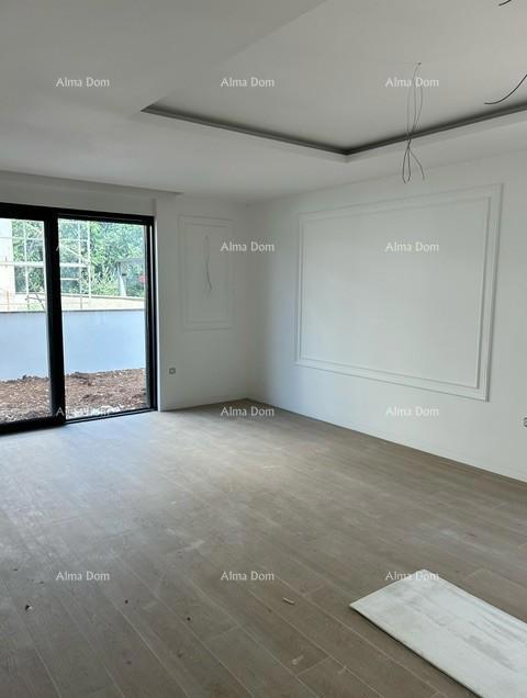 ŠTINJAN.  In vendita: Appartamento in un edificio nuovo con giardino!