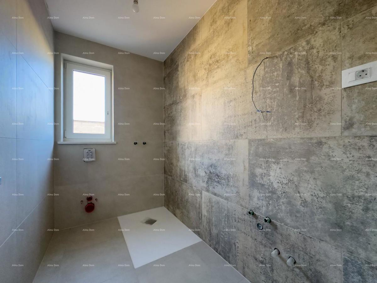 Vendiamo un appartamento con un grande giardino a Barban.