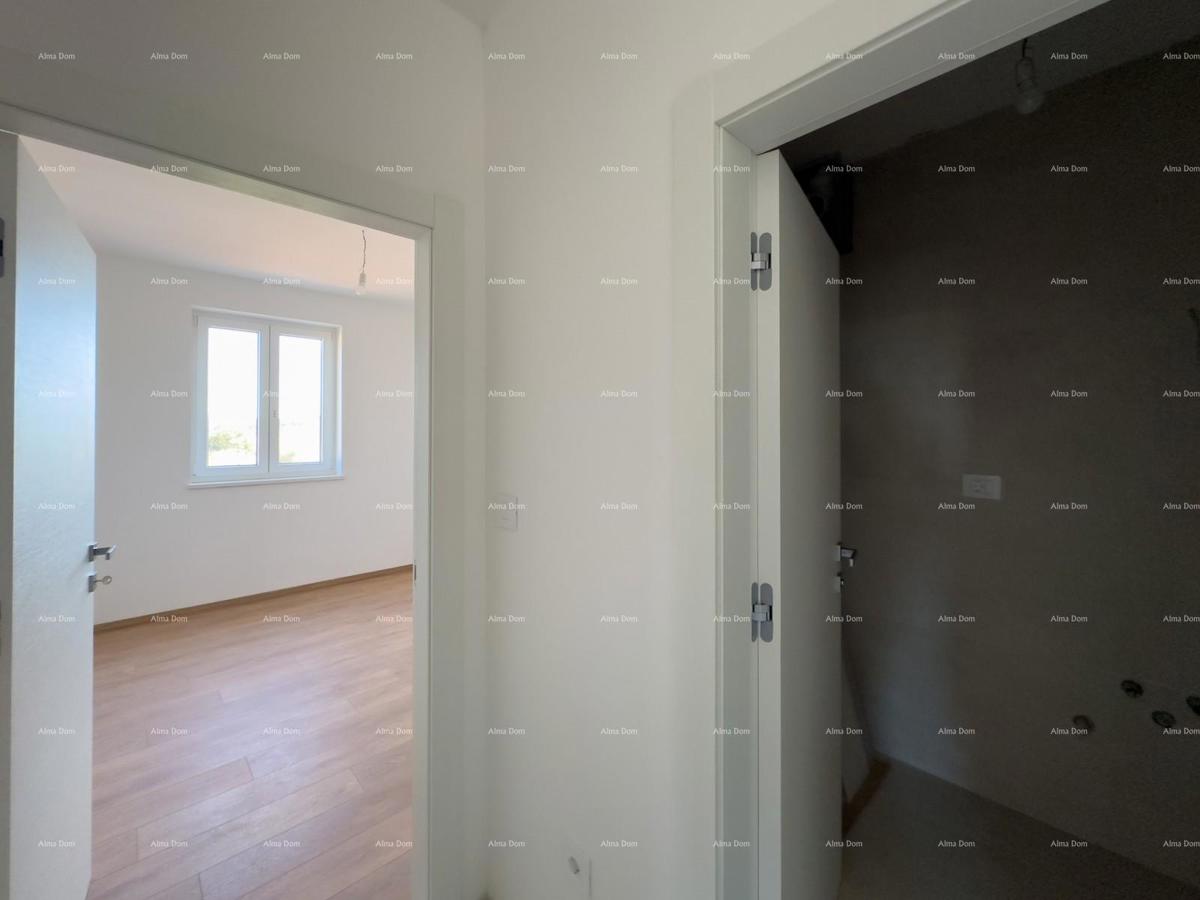 Vendiamo un appartamento con un grande giardino a Barban.