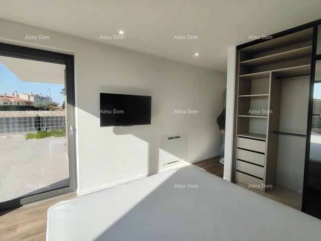 Eccellente appartamento trilocale con giardino e piscina, arredato