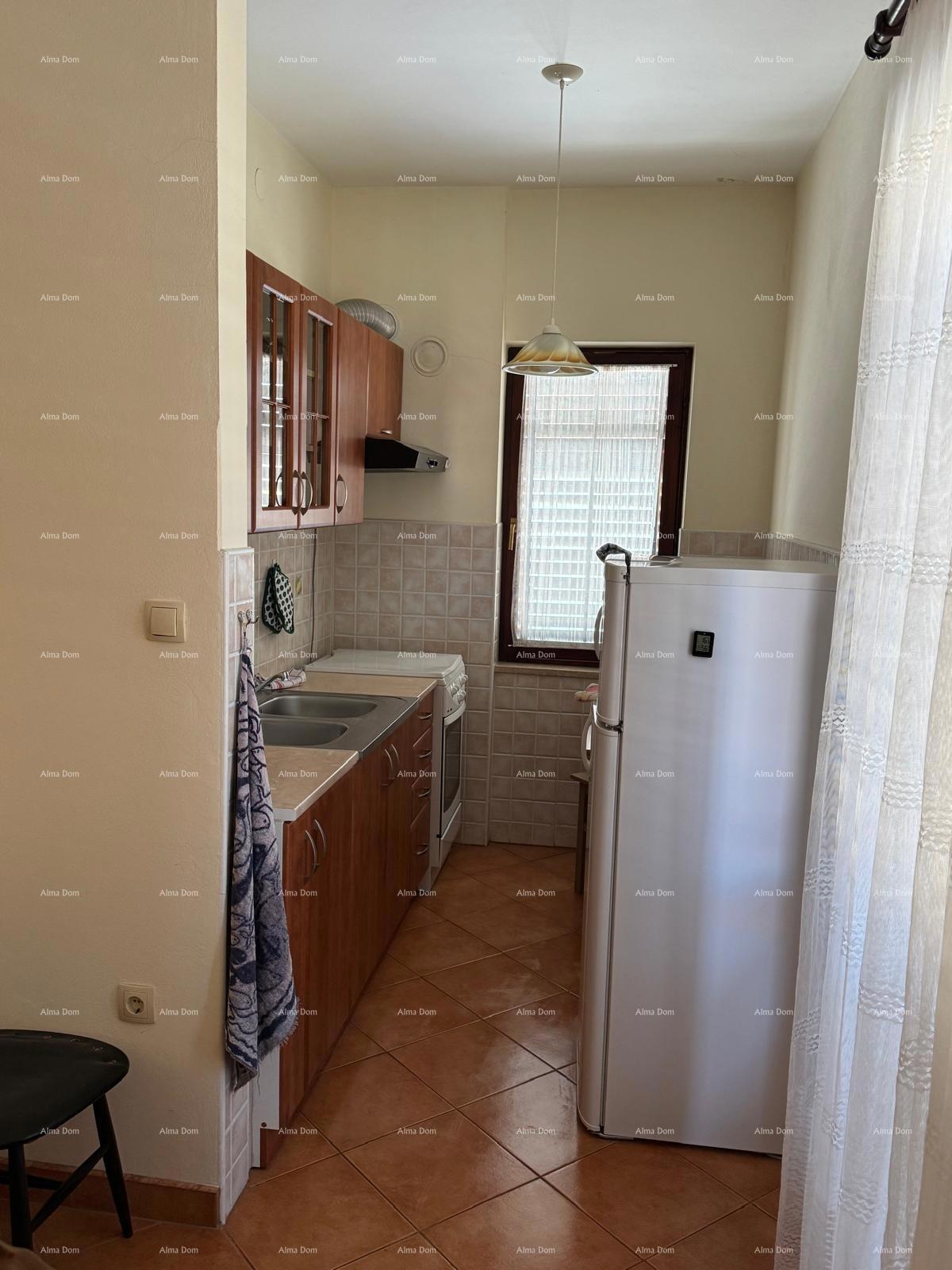 Casa nel centro di Marčana con 2 appartamenti, cantina e laboratorio