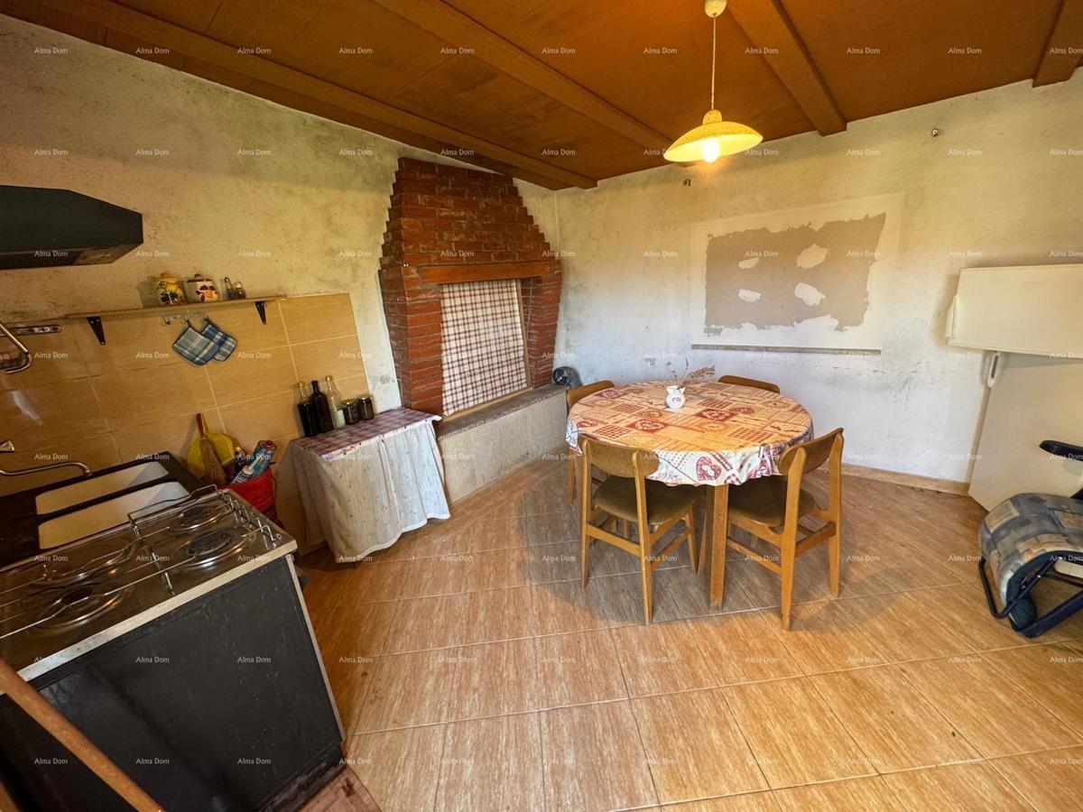 Casa nel centro di Marčana con 2 appartamenti, cantina e laboratorio