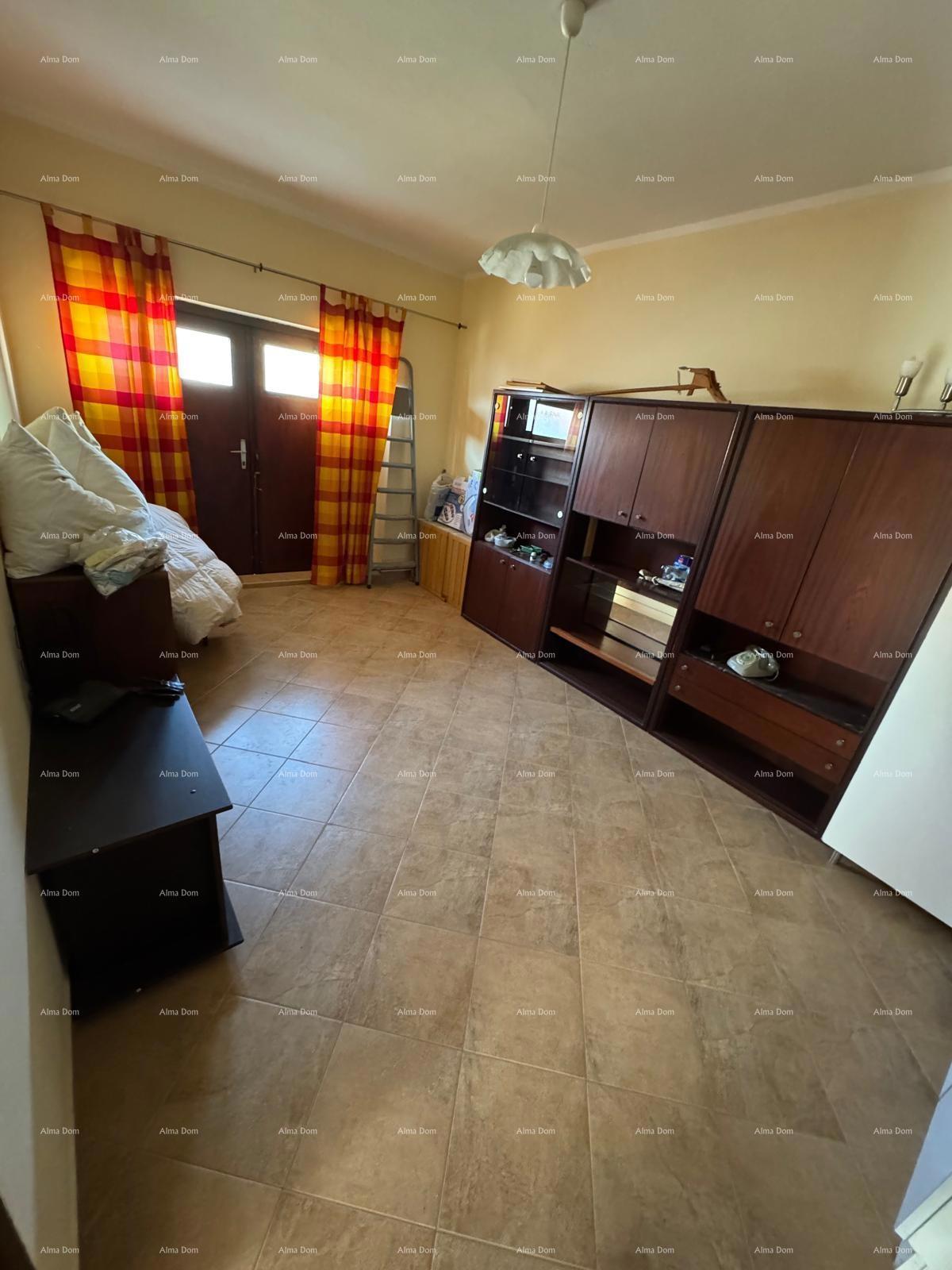 Casa nel centro di Marčana con 2 appartamenti, cantina e laboratorio