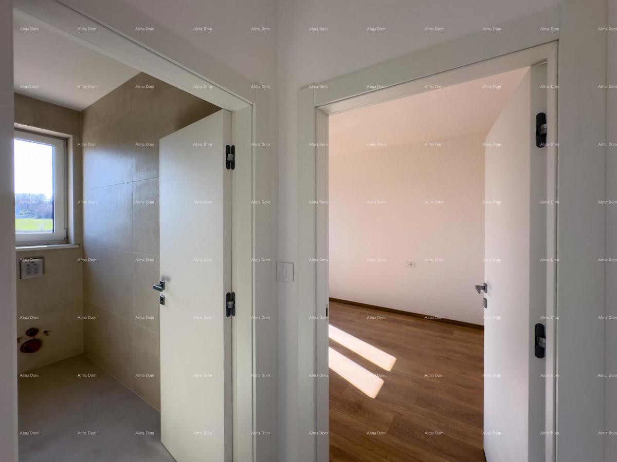 Vendiamo un appartamento con un grande giardino a Barban.