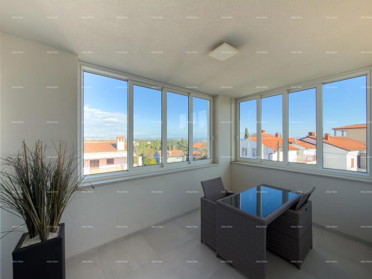 In vendita una casa attraente a Premantura con vista mare.