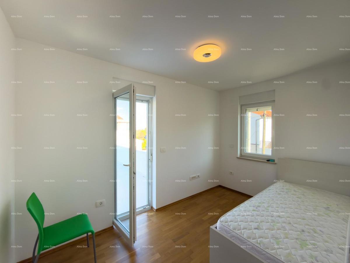 In vendita una casa attraente a Premantura con vista mare.