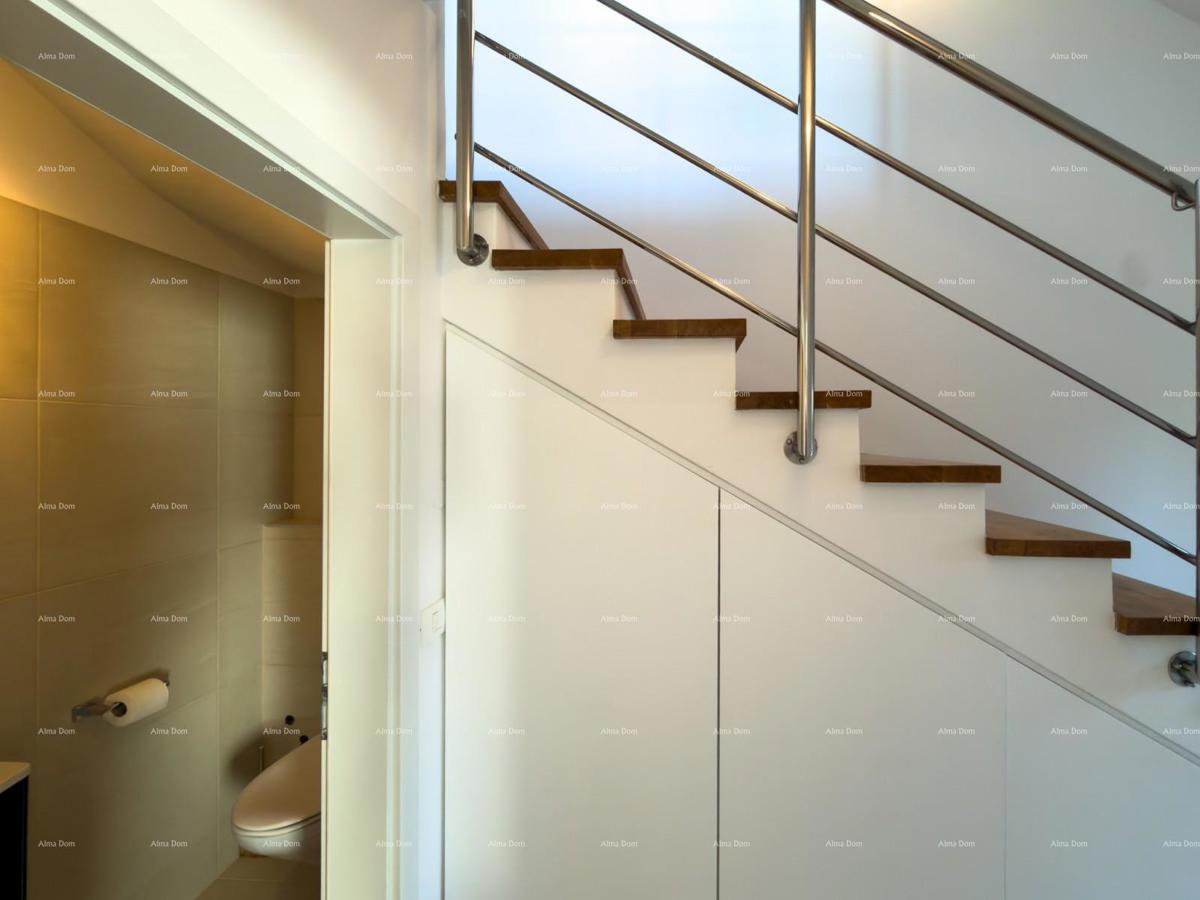 In vendita una casa attraente a Premantura con vista mare.