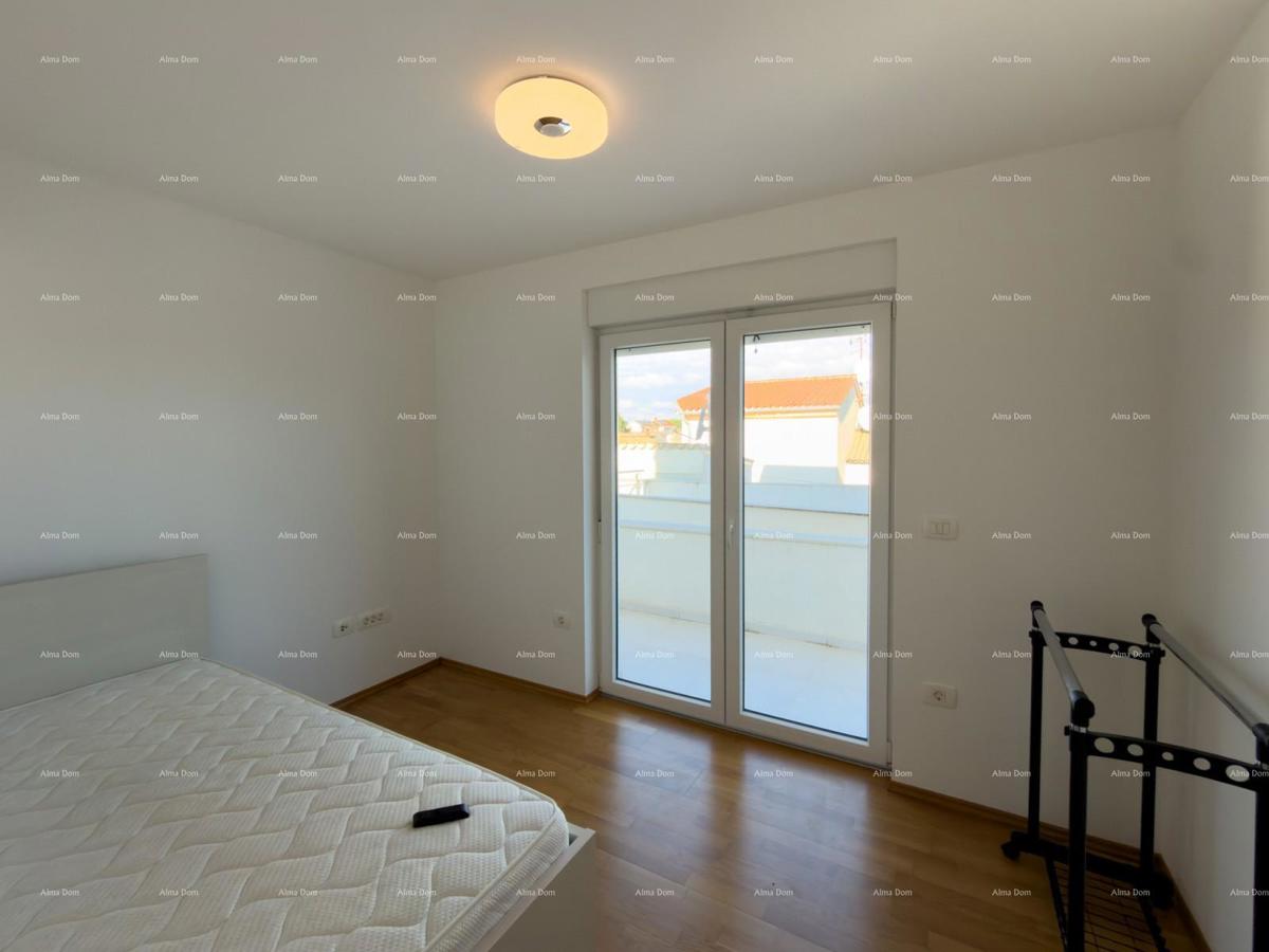 In vendita una casa attraente a Premantura con vista mare.