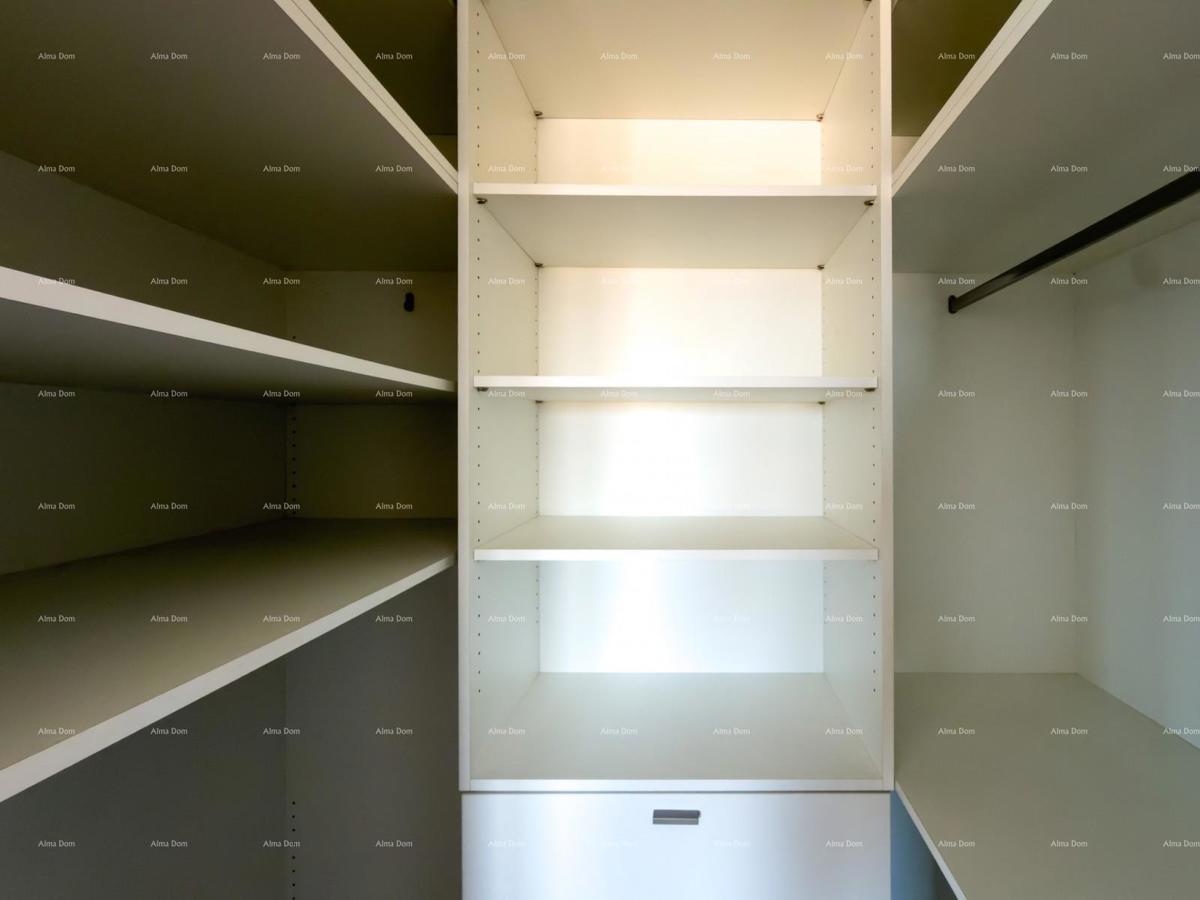 In vendita una casa attraente a Premantura con vista mare.