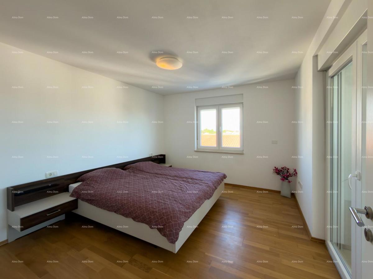 In vendita una casa attraente a Premantura con vista mare.