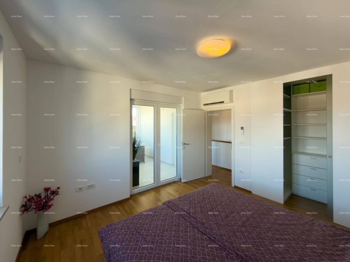 In vendita una casa attraente a Premantura con vista mare.