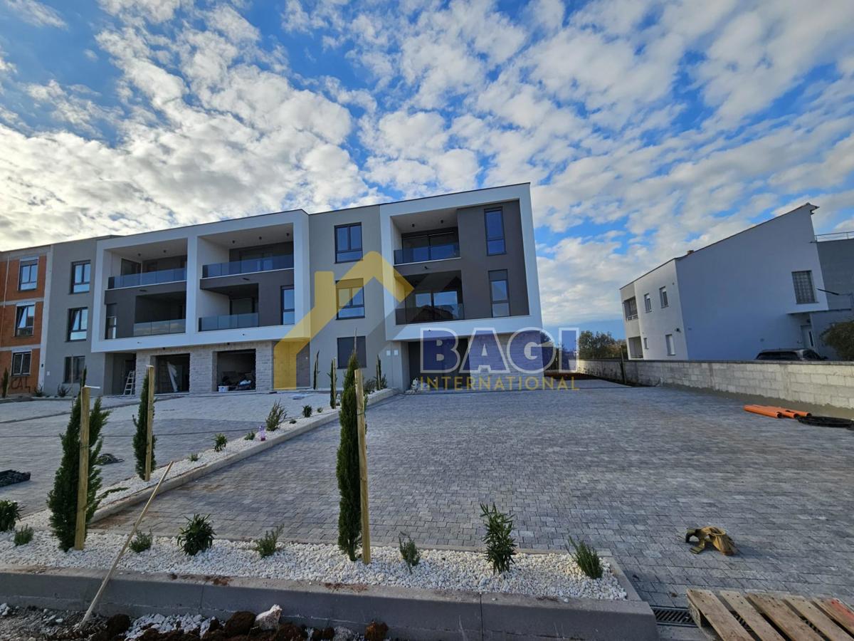 Appartamento 65,95m2-Giardino 77m2-due posti auto