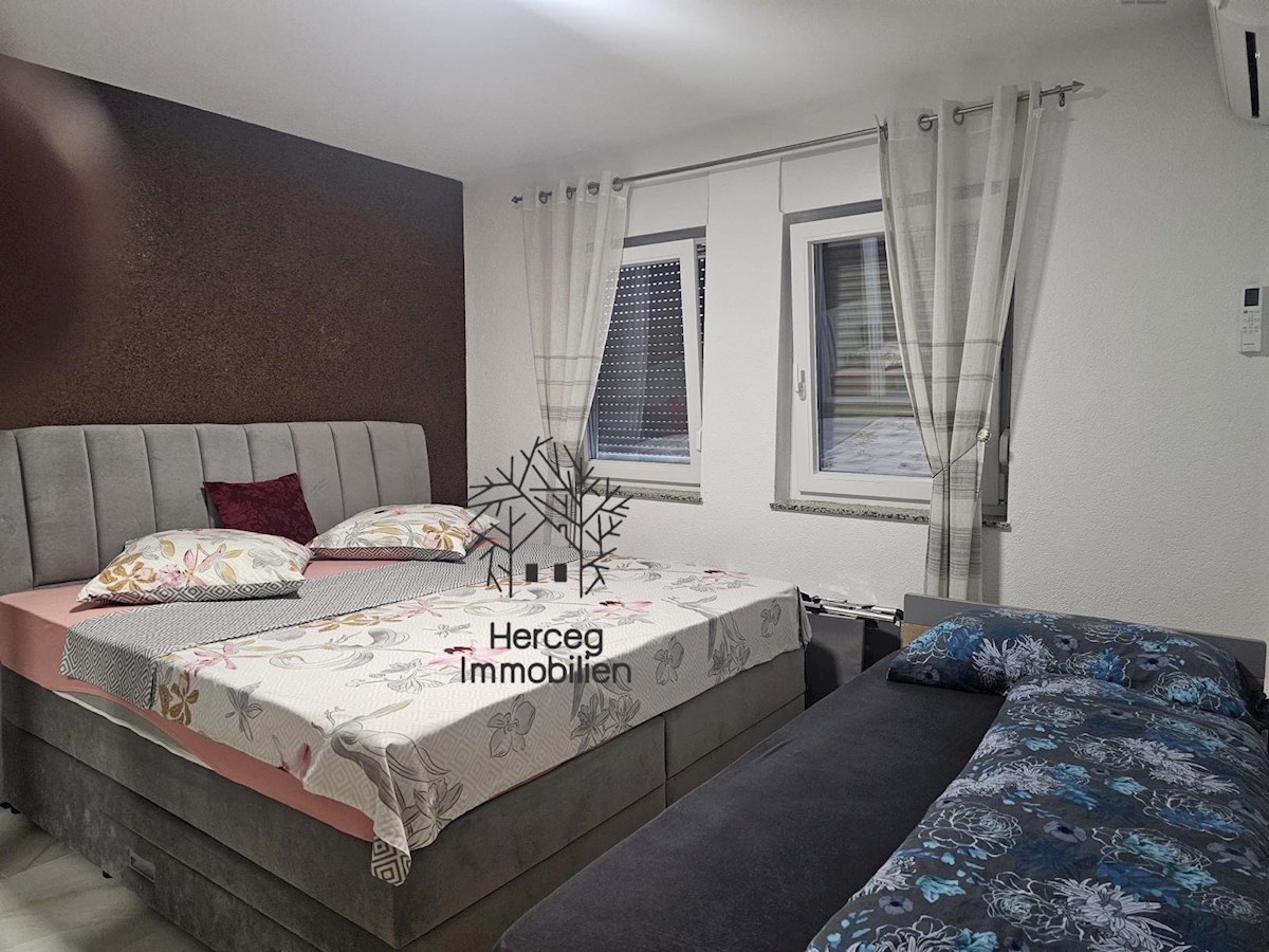 MEDULIN – Appartamento al piano terra con giardino