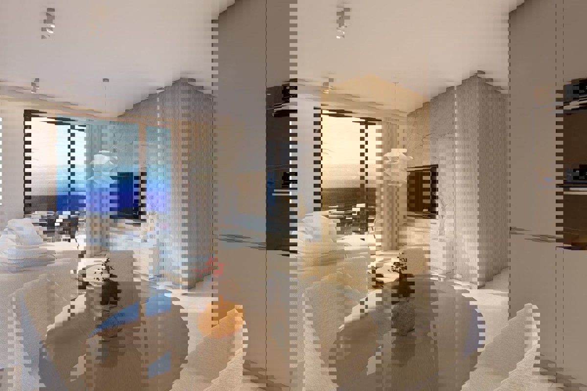 Attraente appartamento con due camere da letto in un edificio di nuova costruzione con vista parziale sul mare