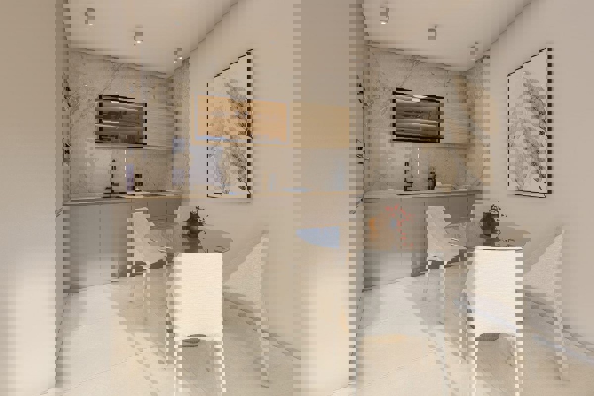 Attraente appartamento con due camere da letto in un edificio di nuova costruzione con vista parziale sul mare