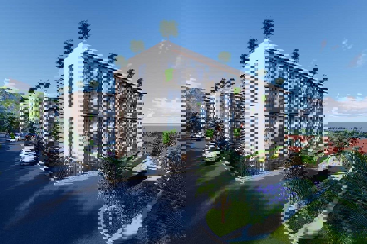 Attraente appartamento con due camere da letto in un edificio di nuova costruzione con vista parziale sul mare