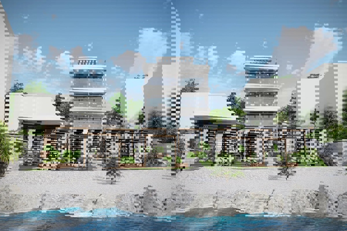 Moderno appartamento con due camere da letto e giardino in prima fila sul mare