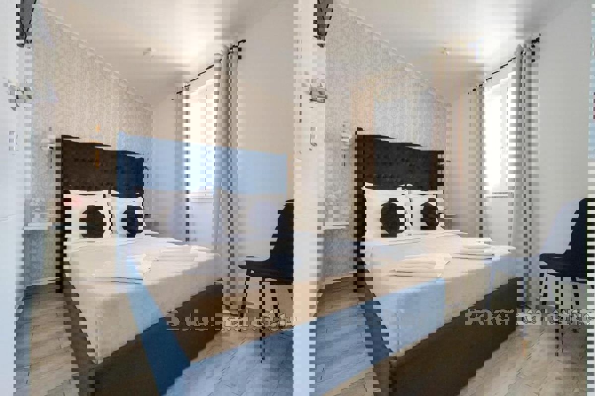 Casa con locale commerciale e terreno edificabile