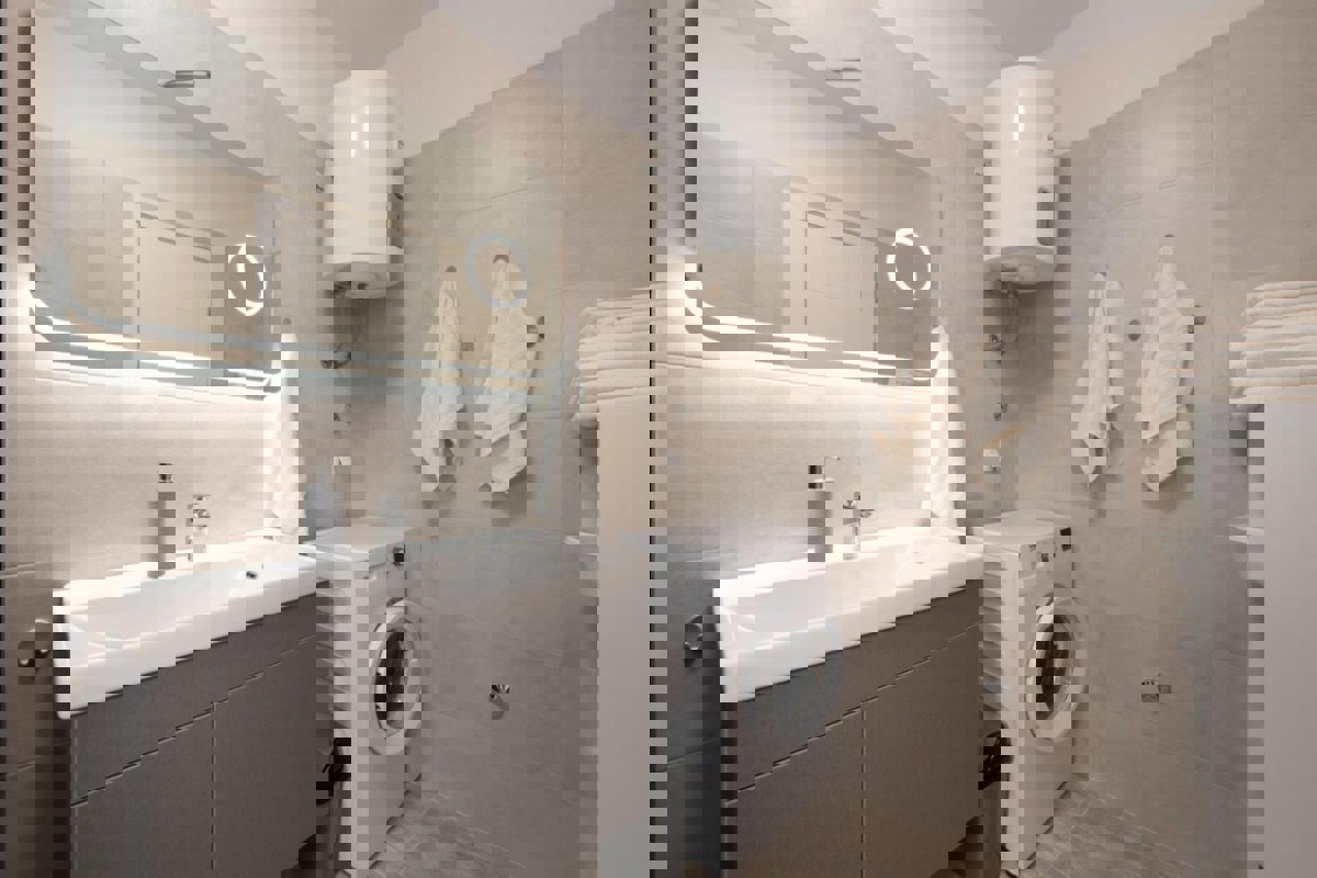 Appartamento con tre camere da letto e vista mare