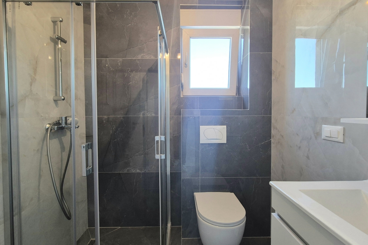 Appartamento in un edificio di nuova costruzione con posto auto