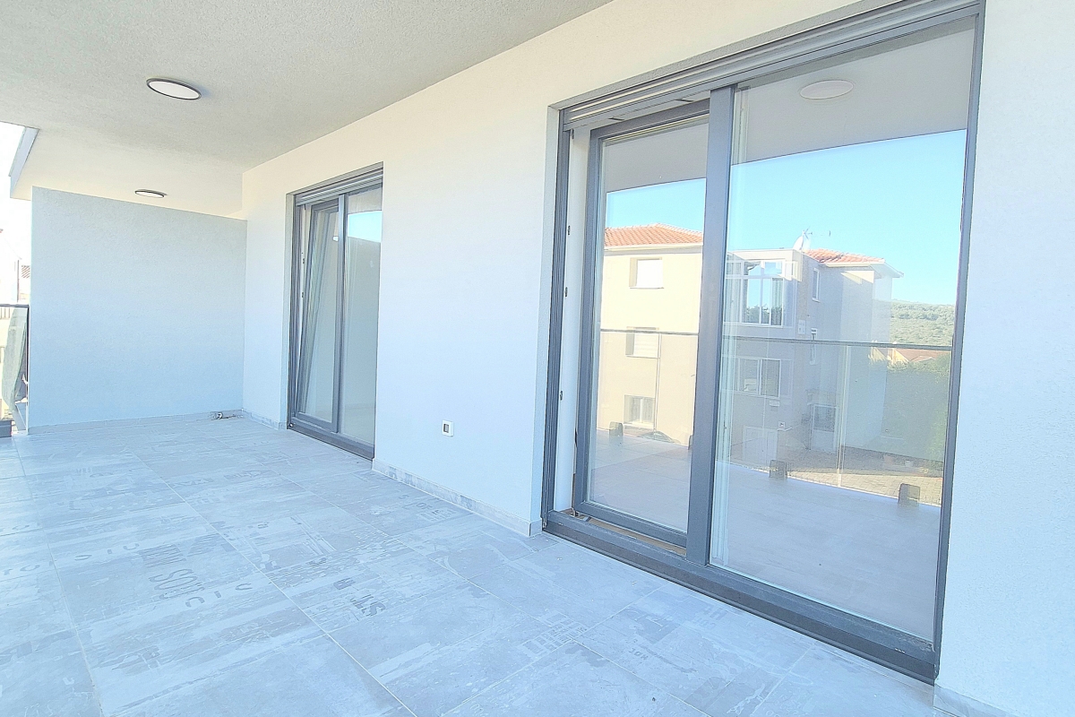 Appartamento in un edificio di nuova costruzione con posto auto