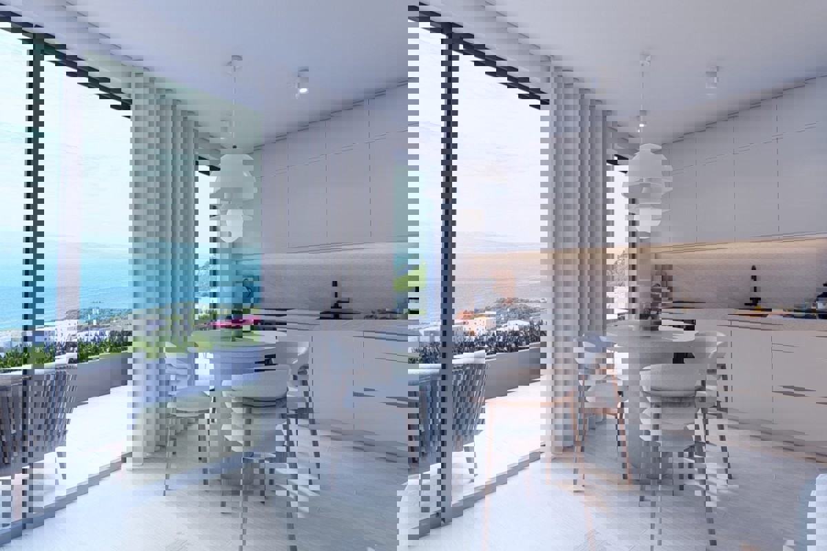 Moderno appartamento con tre camere da letto in un edificio di nuova costruzione con vista mare
