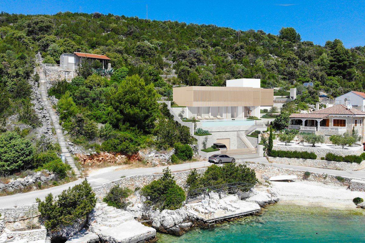 Ampio terreno esposto a sud in riva al mare con un progetto vicino a Trogir