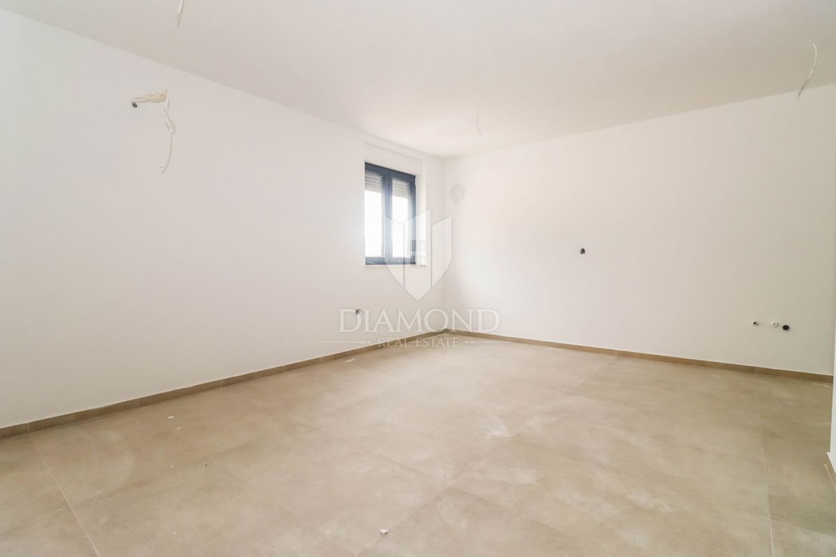 Nuova costruzione nel verde, Appartamento di 55 m² vicino al mare e al centro città