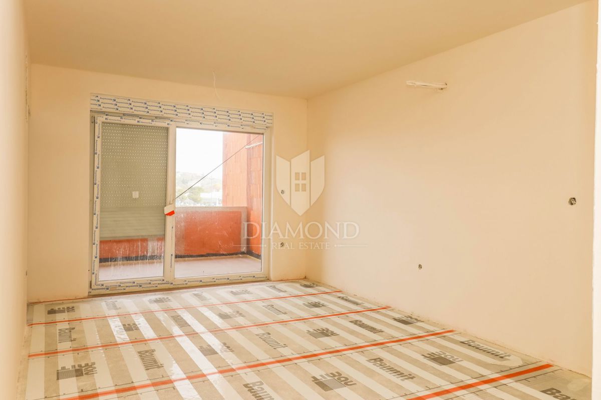 Pola: confortevole appartamento con 2 camere da letto e 2 posti auto.