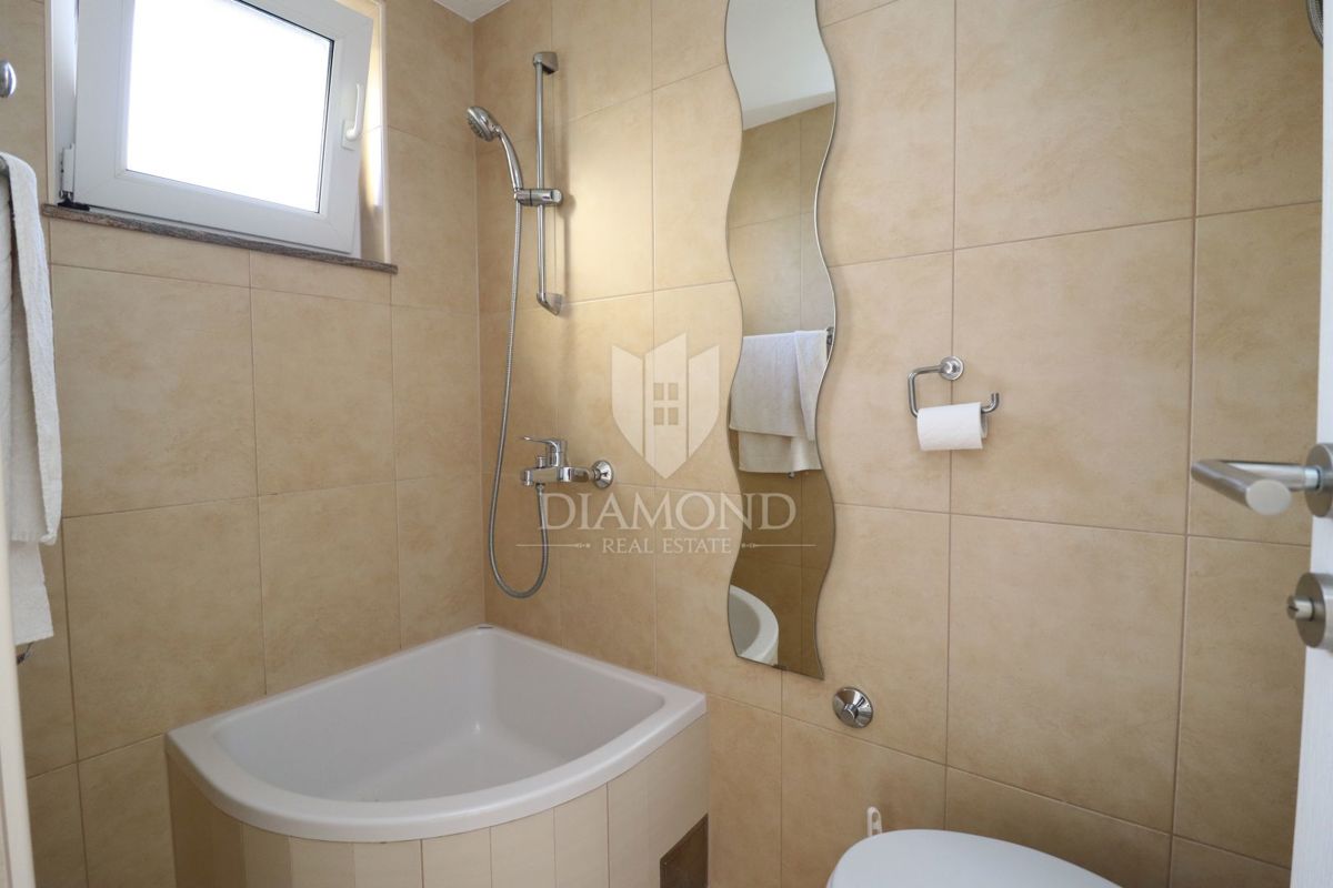 Parenzo, casa di famiglia a schiera con taverna