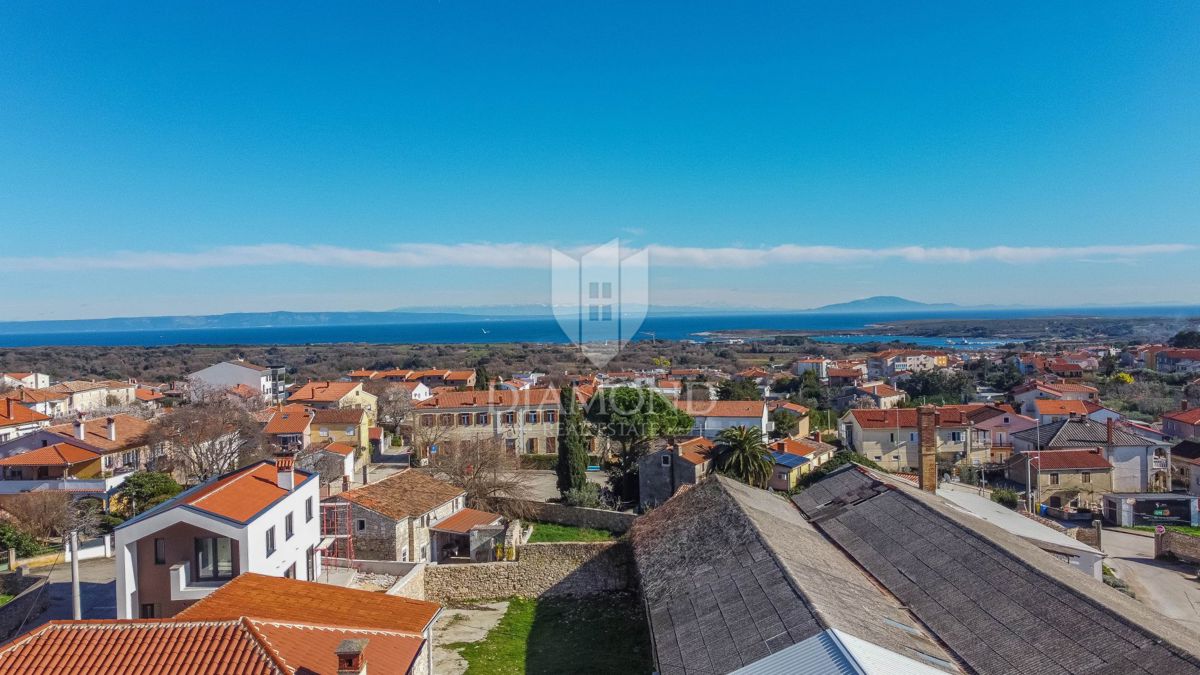 Medolino, attico con vista mozzafiato