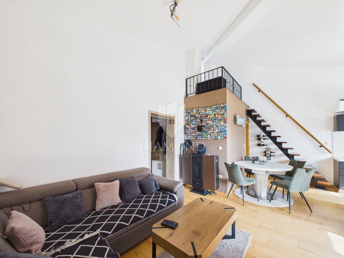 Appartamento di carattere con galleria e loggia.