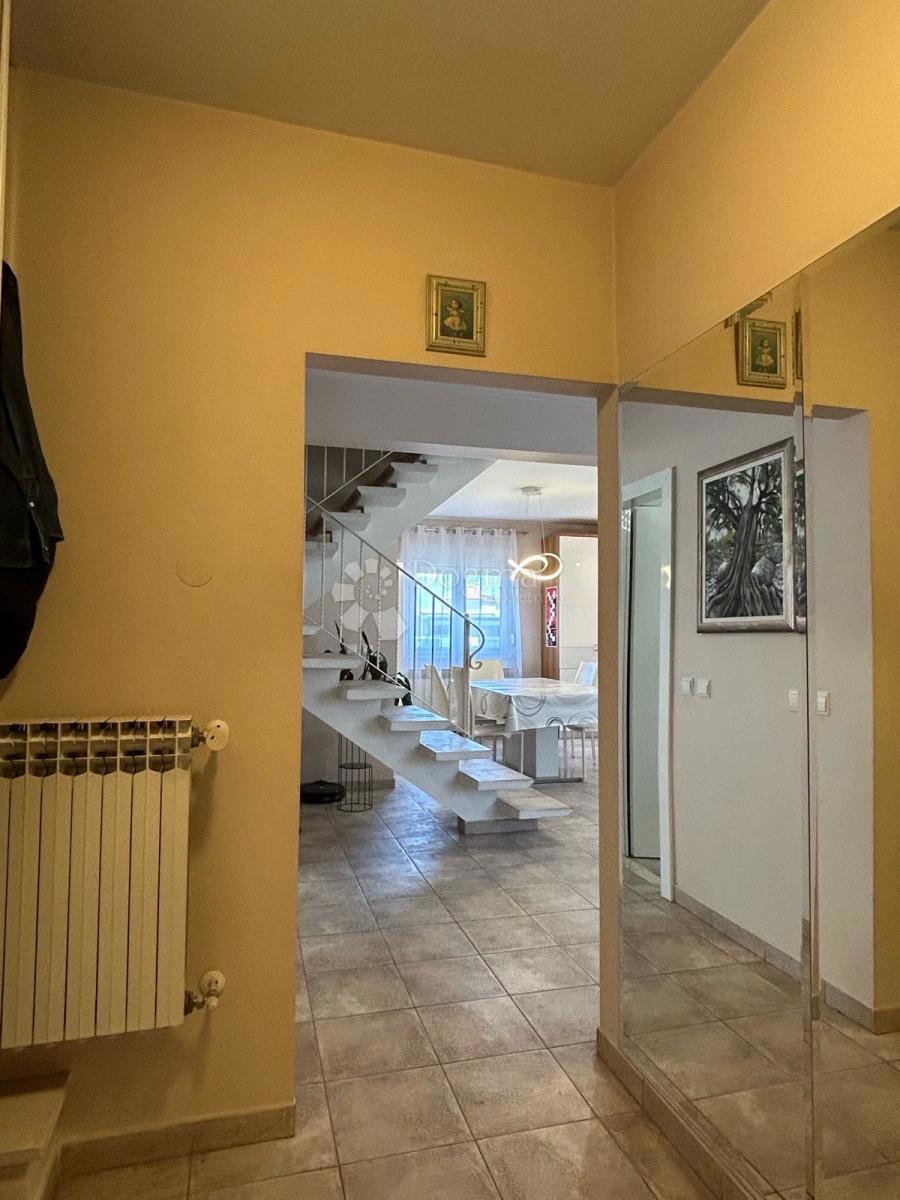 Appartamento Duplex Trilocale 114 m² con Giardino e Vista Aperta