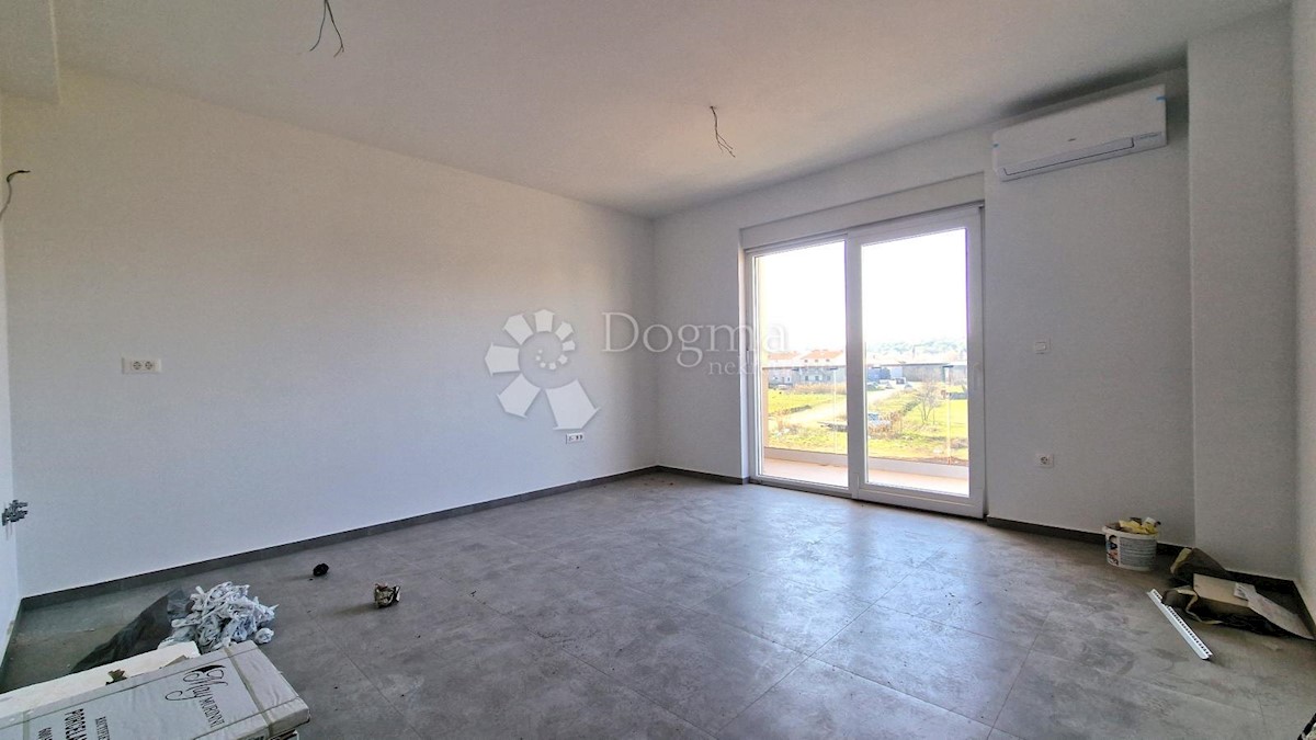 Spazioso appartamento con garage e 2 balconi in bella posizione!