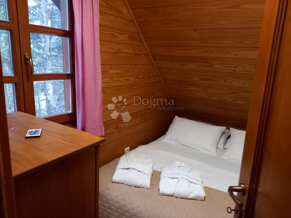 Autentica casa in legno con ampio terreno e centro benessere