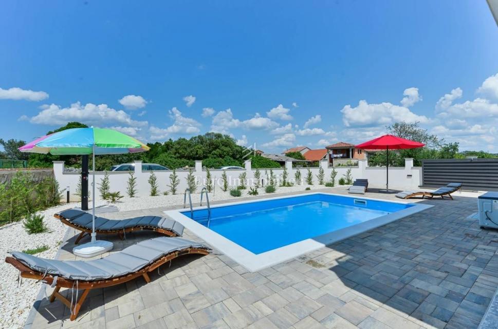 Two-story apartment with a pool in a quiet location