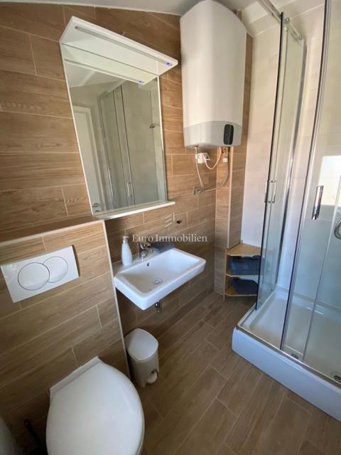 Tisno - Appartamento con giardino e vista mare