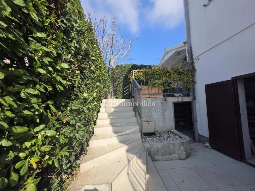 Appartamento con giardino e garage in posizione eccellente