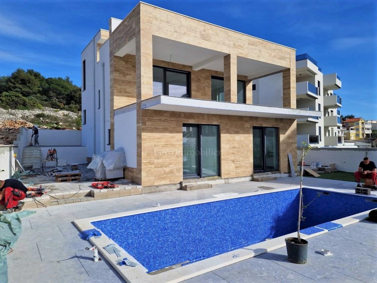 Modern villa with pool, garage and sea views