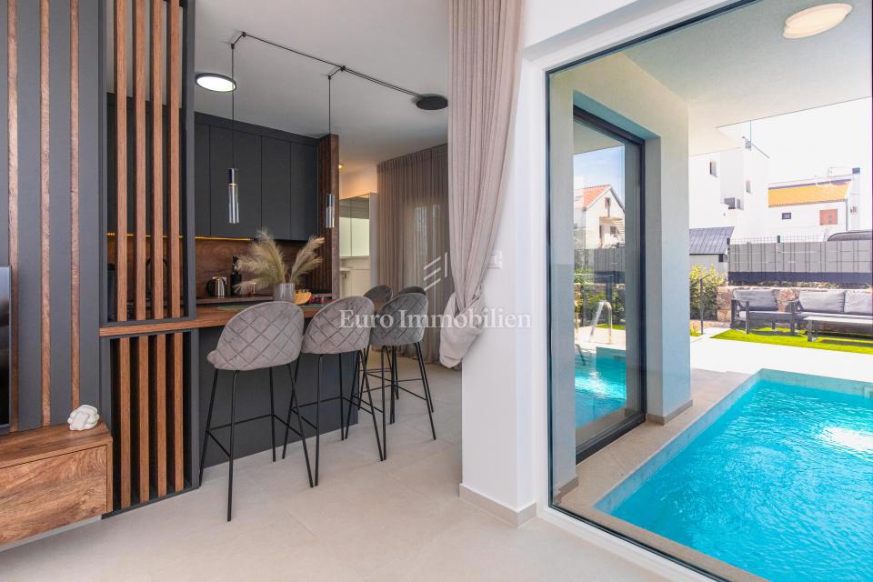 Appartamento con piscina e giardino