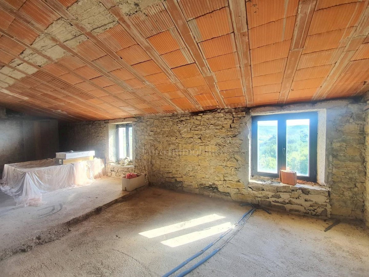 Stone house in a row with a sea view