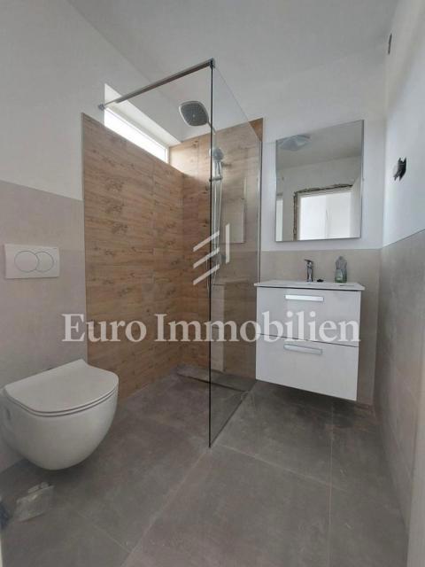 Modern two-story apartment with sea view in a good location, Tisno