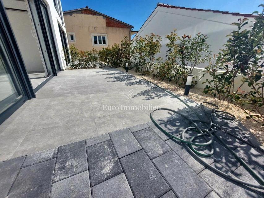 Modern two-story apartment with sea view in a good location, Tisno